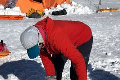 04C Guide Pachi Demonstrating How To Place The Wag Bag In The Toilet Bucket At Mount Vinson Low Camp